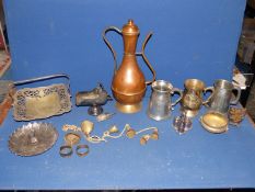 A quantity of brass and metals including cow bells, large copper urn, tankards, Pewter dish,