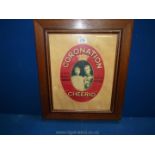 A wooden framed oval mounted advertisement for ''Coronation Cheerio', A non-Alcoholic Champagne',