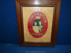 A wooden framed oval mounted advertisement for ''Coronation Cheerio', A non-Alcoholic Champagne',