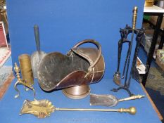 A quantity of brass including shell case, fire irons, companion set, coal scuttle, etc.