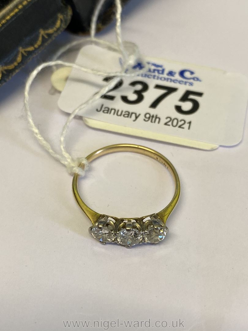 A good Gold three Diamond engagement Ring with platinum setting,
