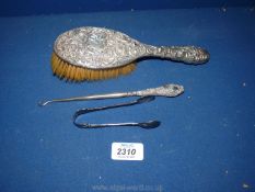 A Silver backed hair Brush, (Birmingham) and button hook together with epns sugar tongs.