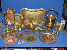 A box of mixed brass to include candlesticks, brass trays, decorative handled vessel,