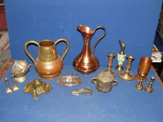 A quantity of brass and metals including large copper jug, inkwell, toast rack, candlesticks, etc.