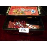 An oriental Musical jewellery box containing miscellaneous vintage brooches, necklace, etc.