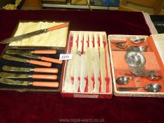 Miscellaneous cutlery including bone handled knives, tea knives with coral coloured handles, etc.