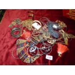 A quantity of costume jewellery including bangles, necklaces, ear-rings, etc.