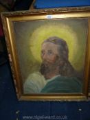 A large Oil on board depicting Christ, signed indistinctly lower left E.T.