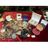 A box of costume jewellery including necklaces, bracelets, boxes of cuff links, etc.