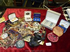 A box of costume jewellery including necklaces, bracelets, boxes of cuff links, etc.