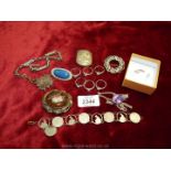 A silver brooch, pendant and chain, coin bracelet, fob watch chain, rings, etc.