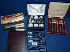 A cased set of plated serviette rings, a Butler & Co. Ltd.
