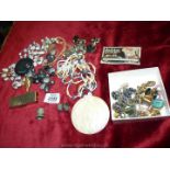 A quantity of costume jewellery including clip on ear-rings, necklaces, brooches, thimbles,