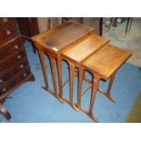 An attractive Nest of three Teakwood occasional Tables, the largest,