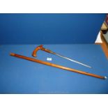 A polished wooded handled and sheathed Sword stick, 13 3/4'' blade,