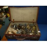 A leather suitcase and a good quantity of oil lamp components, burners, wicks etc.