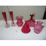 Six pieces of Cranberry Glass including pair of bud vases, decanter, two jugs and a vase,