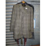 A gents tweed made to measure suit consisting of a button up jacket and trousers with braces,