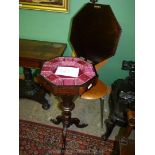 An elegant Rosewood Work Table of tapering octagonal form raised on a turned support with three