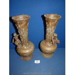 A pair of bronzed effect Spelter Vases decorated with carp and seated children, approx 12" high.