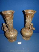 A pair of bronzed effect Spelter Vases decorated with carp and seated children, approx 12" high.