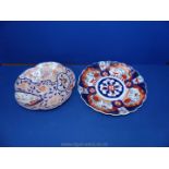 Two oriental chargers in Imari patterns, 12'' and 11'' diameters,