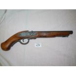 A replica decorative Flintlock Pistol of wood and die-cast metal construction, hammer absent,