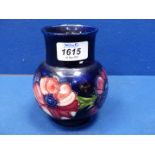 A Moorcroft vase decorated with Anemones,