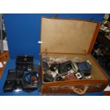 A leather suitcase (a/f) and contents including various compact cameras, Olympus Trip MD, etc.