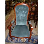 A reproduction darkwood show framed open armed buttonback Armchair.