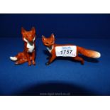 A Beswick small sitting fox, 3" tall and a Beswick small standing fox, 4 1/4" x 2 1/2" tall,