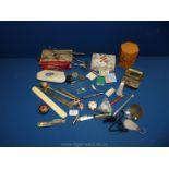 A small box of miscellaneous items including a fruit knife, letter openers,