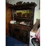 A most substantial circa 1900 dark Oak mirror back Sideboard, the base with a central recess,