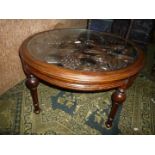 An unusual Mahogany framed circular Occasional Table standing on four turned legs with bulbous