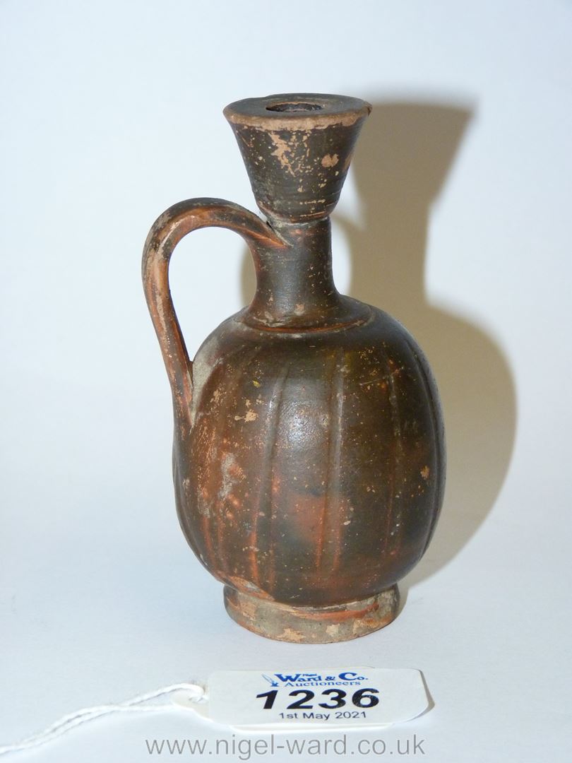 An ancient monochrome glaze small lekythos, of shallow fluted form - South Italian Greek, - Image 2 of 3