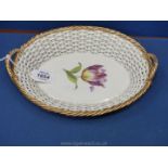 A pretty 19th century Meissen Basket well painted with a single tulip,