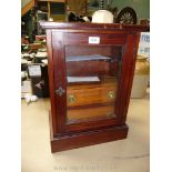 An Oak glass fronted Smokers Cabinet with shelf fitted for pipes and two drawers with brass handles,