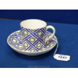 An 18th century Sevres coffee can and saucer,