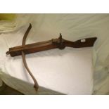 An old continental wood and iron crossbow.