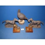 A composite Partridge on a plinth (8 1/2" tall),