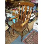 An elegant Elm seated and other woods open armed Chair having a fretworked central splat and