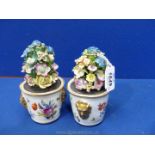 A pair of early 19th century porcelain dinner table decorations in the form of miniature pots of
