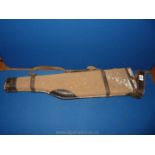A canvas and leather gun case with carry handle, 29 1/2" long,