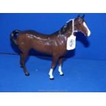 A large Royal Doulton Mare with white blaze to face and two white hooves, 8 1/2'' tall.