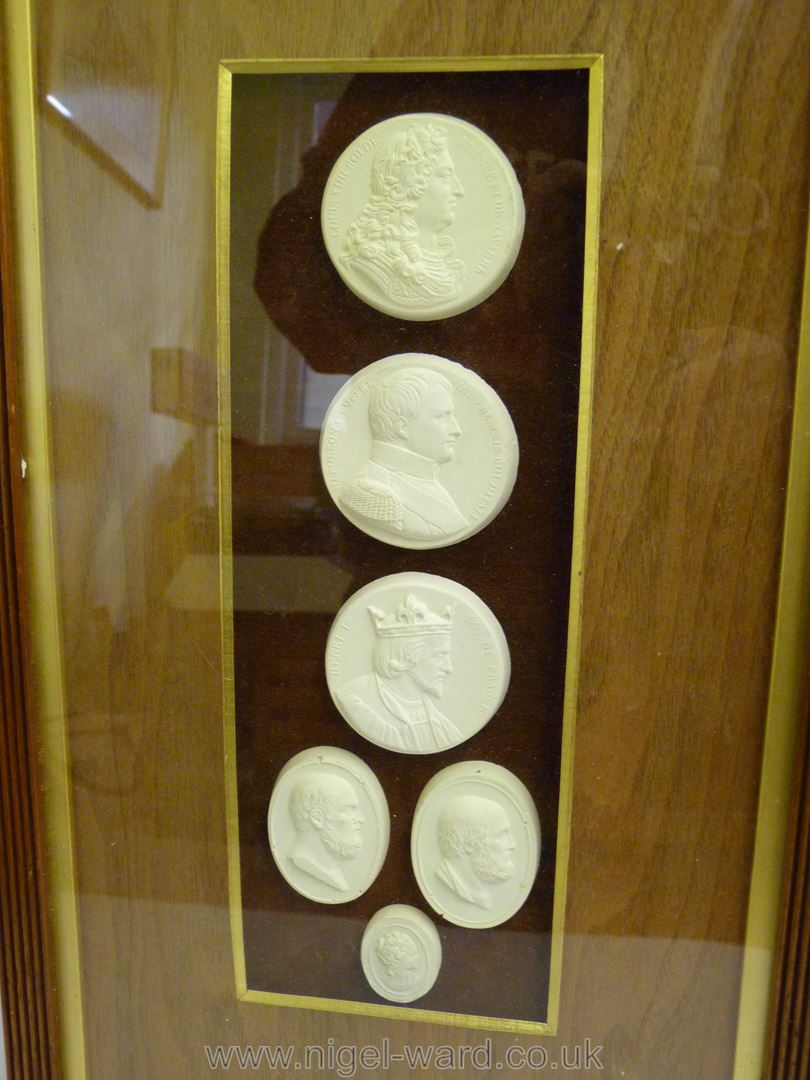 A framed small group of classical plaster cast medallions. - Image 2 of 7