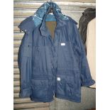 A navy blue Helly Hansen double lined Raincoat with hood,
