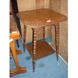 An Edwardian square Mahogany occasional Table on splayed turned legs united by a lower shelf,