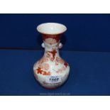 A small unmarked Oriental style vase,