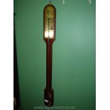 A Mahogany Stick Barometer having a brass scale plate and exposed lower tube section, engraved ''F.