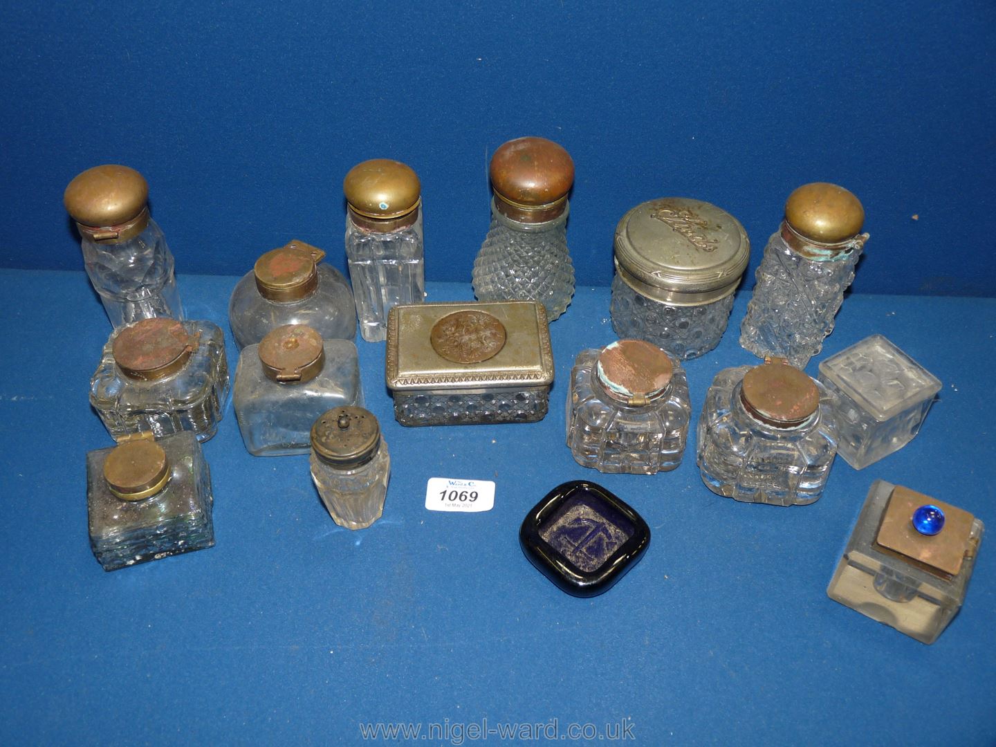 A box of glass ink wells, dressing table sets.